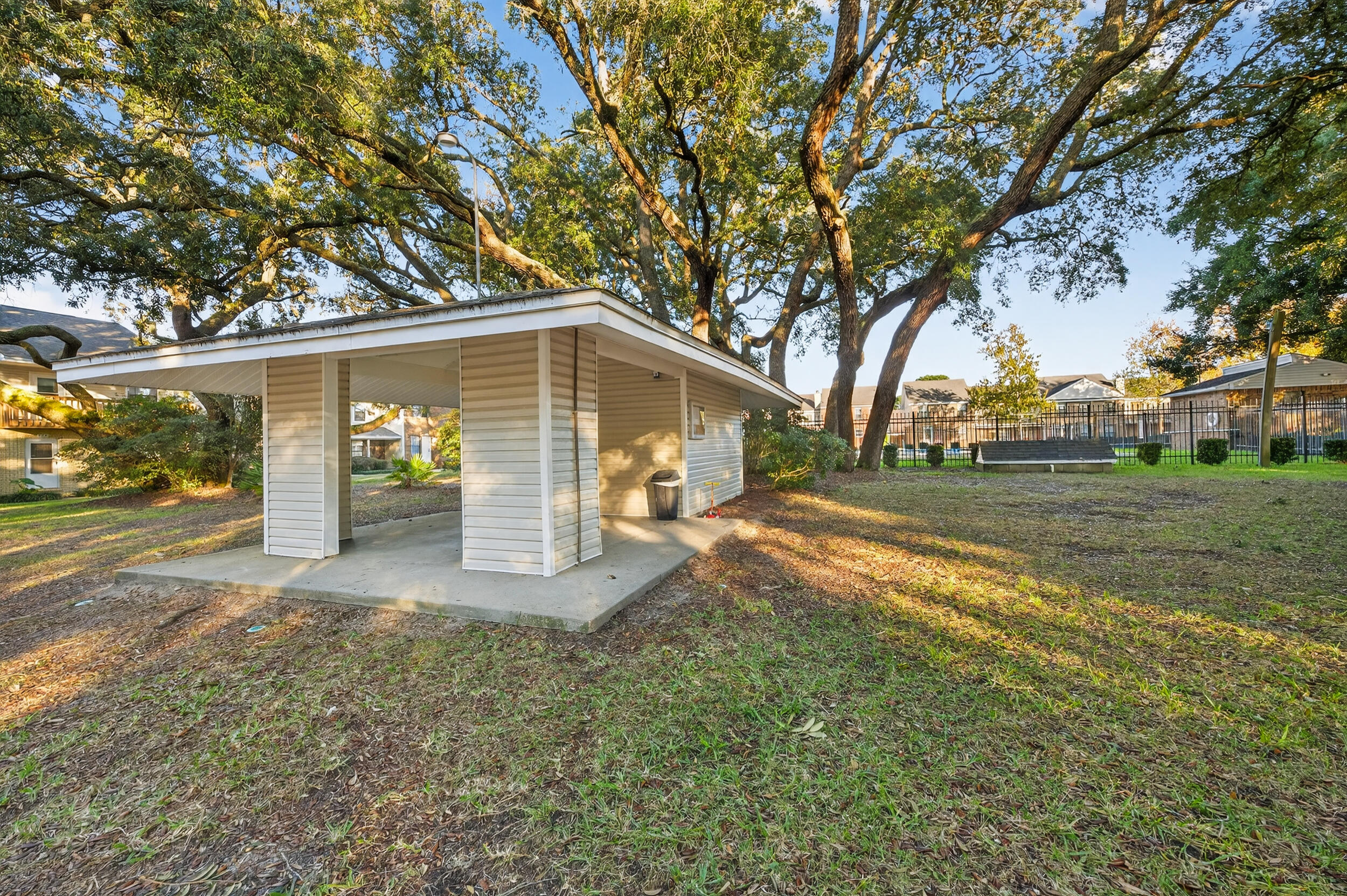 132 5th Avenue Shalimar, FL 32579 - Photo 36 of 39 a view of a yard with potted plants and large tree