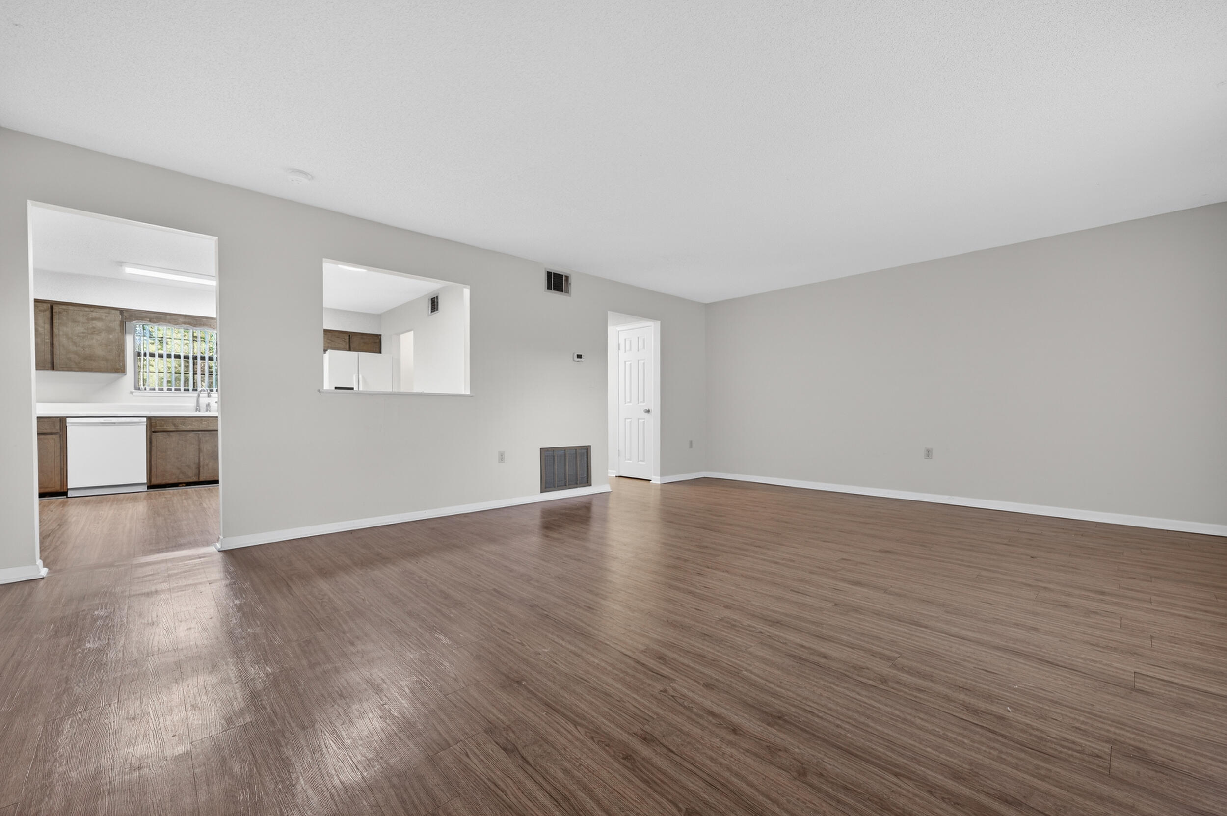 132 5th Avenue Shalimar, FL 32579 - Photo 5 of 39 an empty room with wooden floor and windows