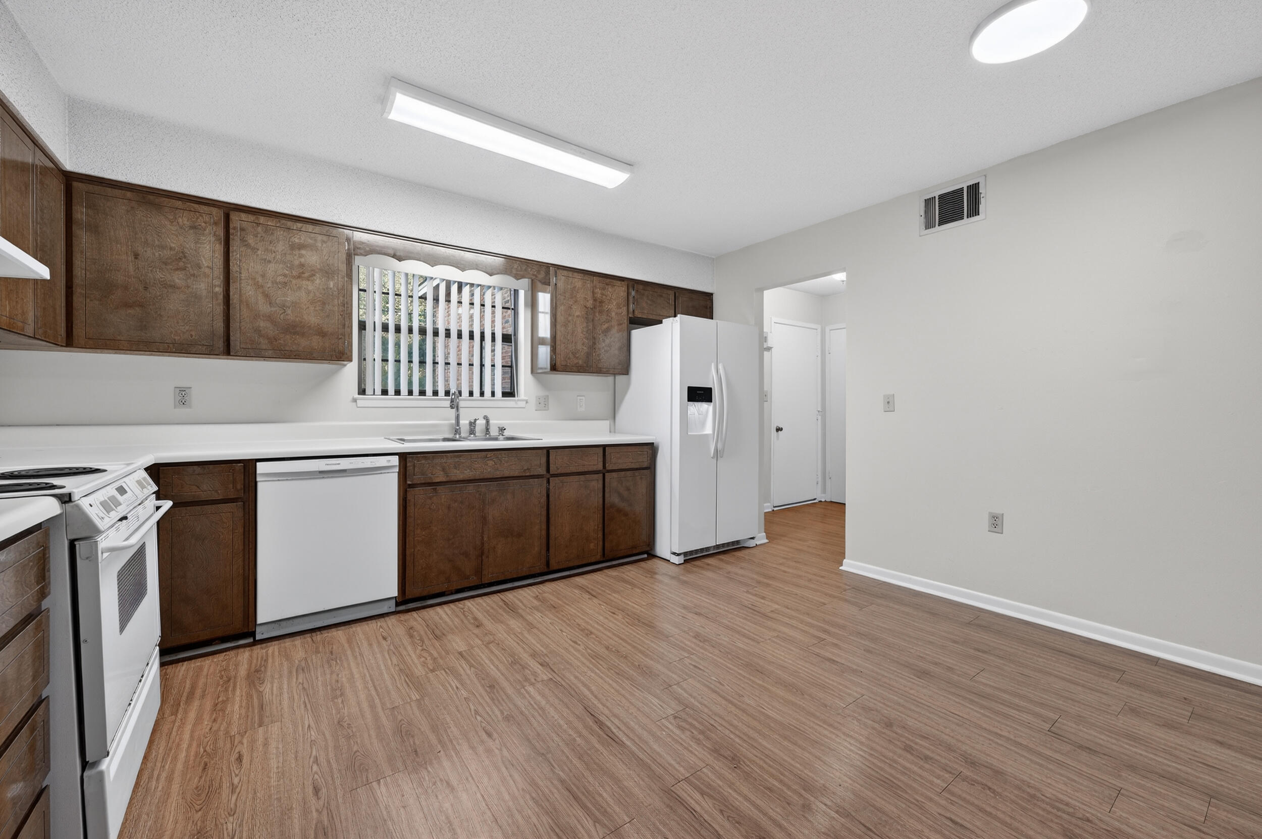 132 5th Avenue Shalimar, FL 32579 - Photo 8 of 39 a kitchen with a sink cabinets and wooden floor