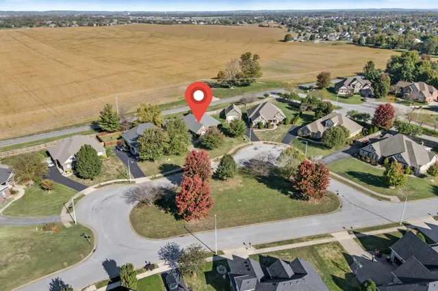 an aerial view of a house with outdoor space