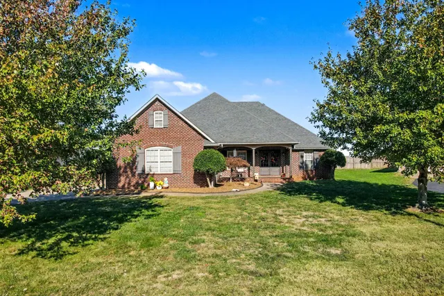 a front view of a house with a yard