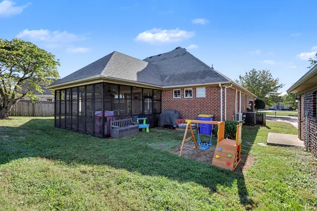 a view of a house with a yard porch and sitting area