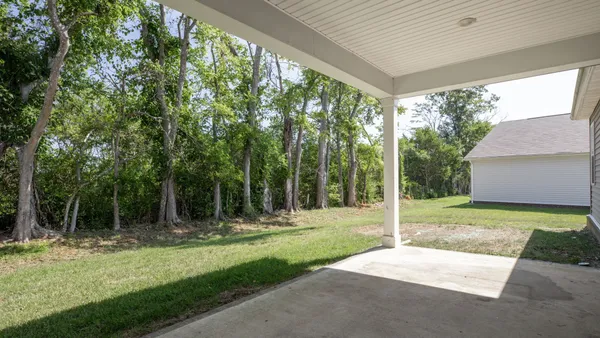 a backyard of a house with lots of green space