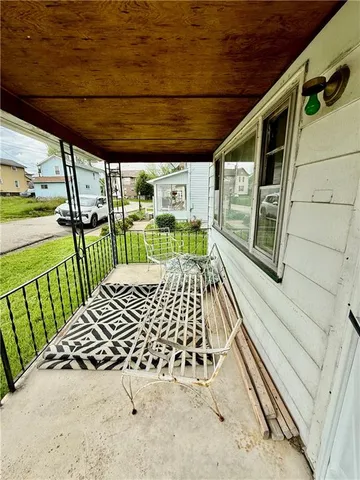 a balcony with wooden floor