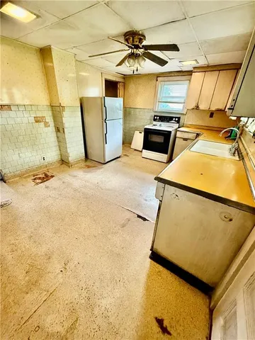 a view of a room with furniture and windows