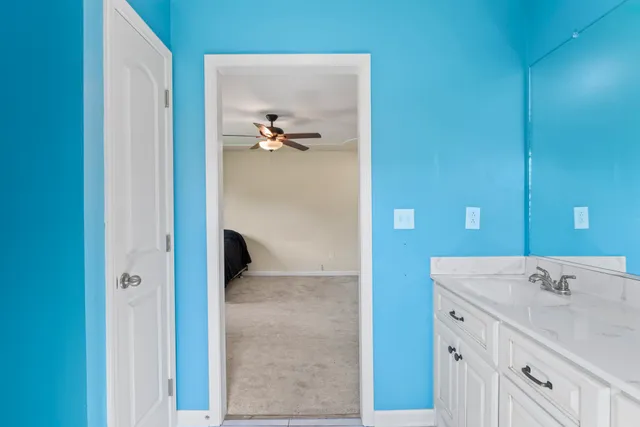 a bathroom with a double vanity sink and mirror