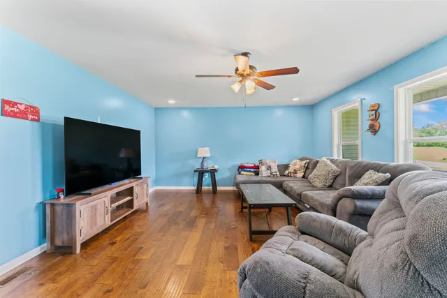 a living room with furniture and a flat screen tv