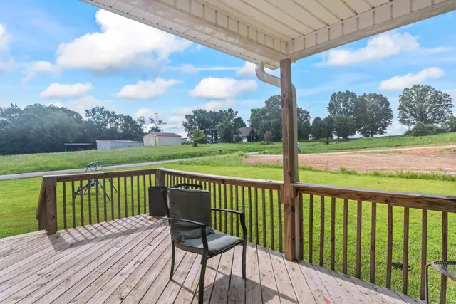 a view of a deck with a yard