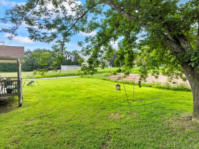a view of a big yard with a house