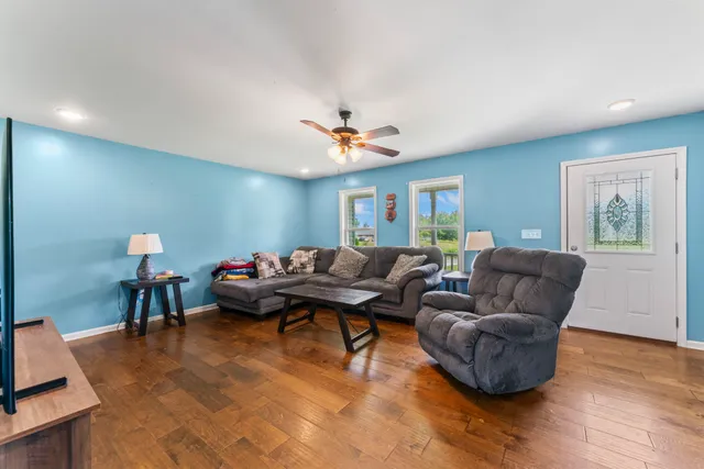 a living room with furniture and a window