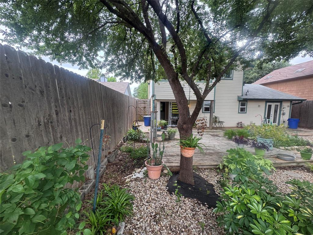 4649 Misty Ridge Drive Fort Worth, TX 76137 - Photo 15 of 25 a backyard of a house with seating space