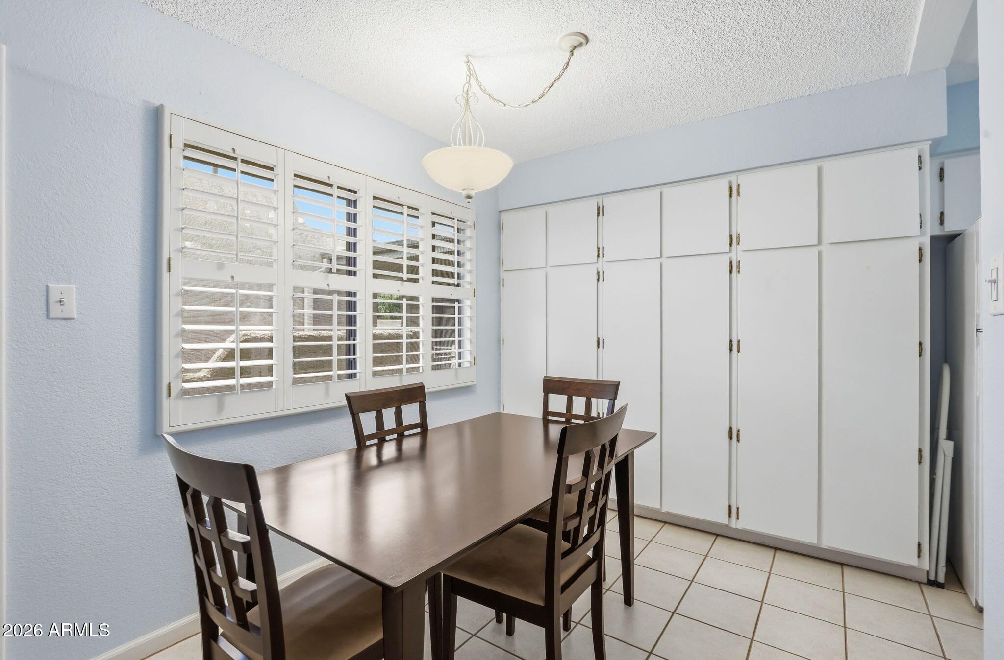 4950 North Miller Road, Unit 339 Scottsdale, AZ 85251 - Photo 14 of 28 a view of a dining room with furniture window and outside view