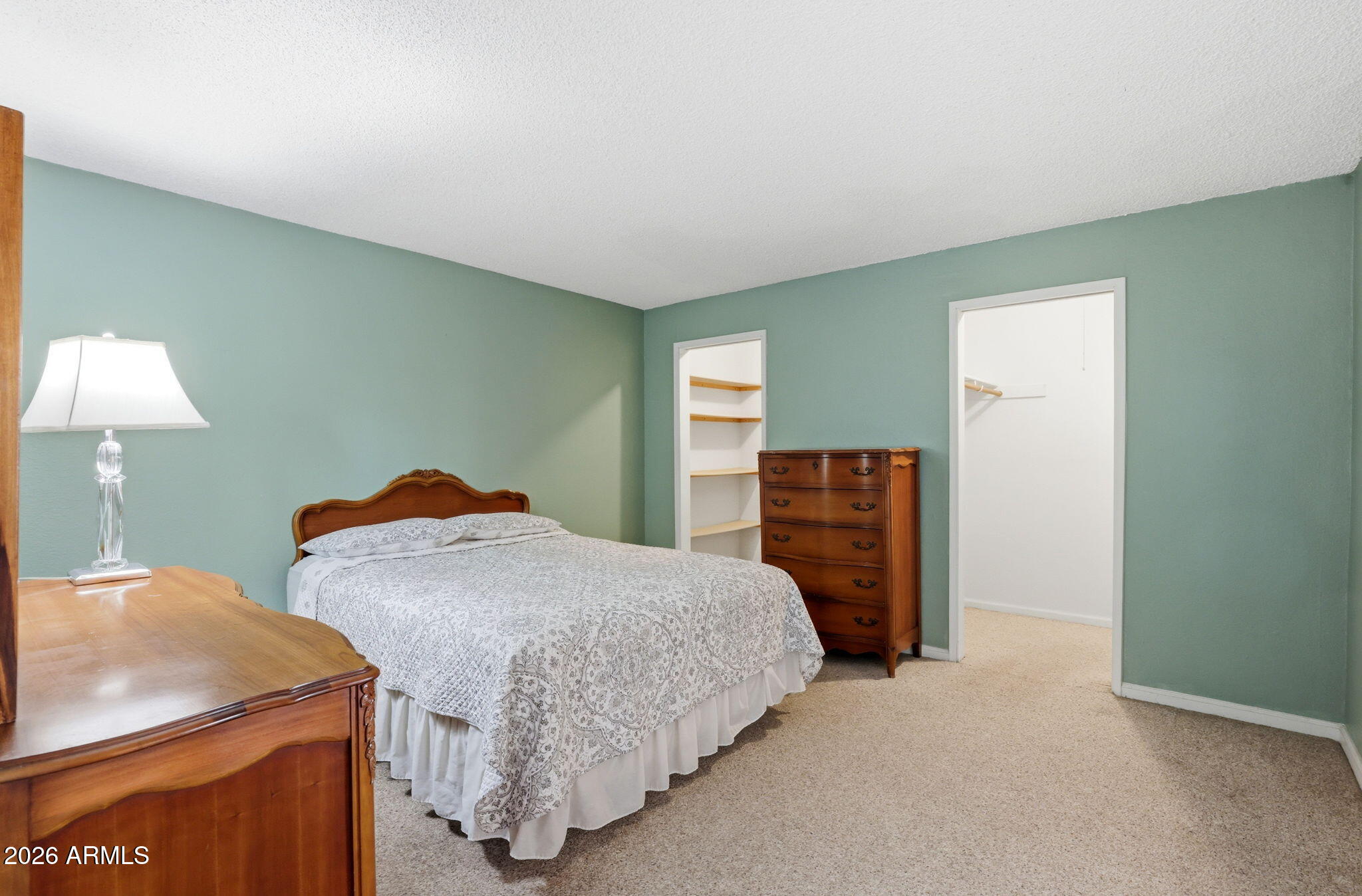 4950 North Miller Road, Unit 339 Scottsdale, AZ 85251 - Photo 21 of 28 a bedroom with a bed and a table