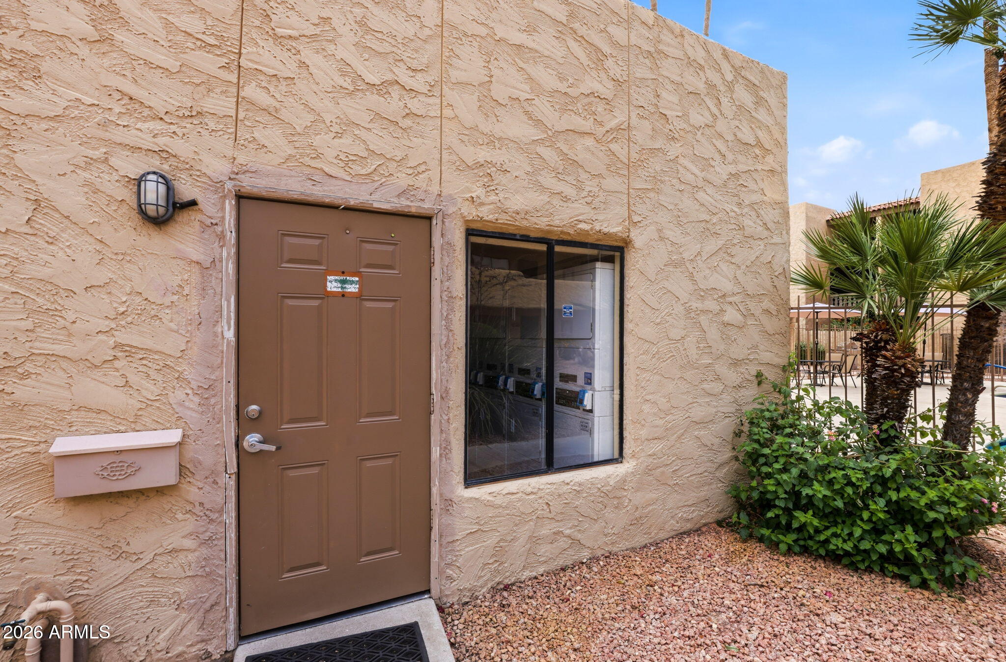 4950 North Miller Road, Unit 339 Scottsdale, AZ 85251 - Photo 3 of 28 a entryway with a outdoor space