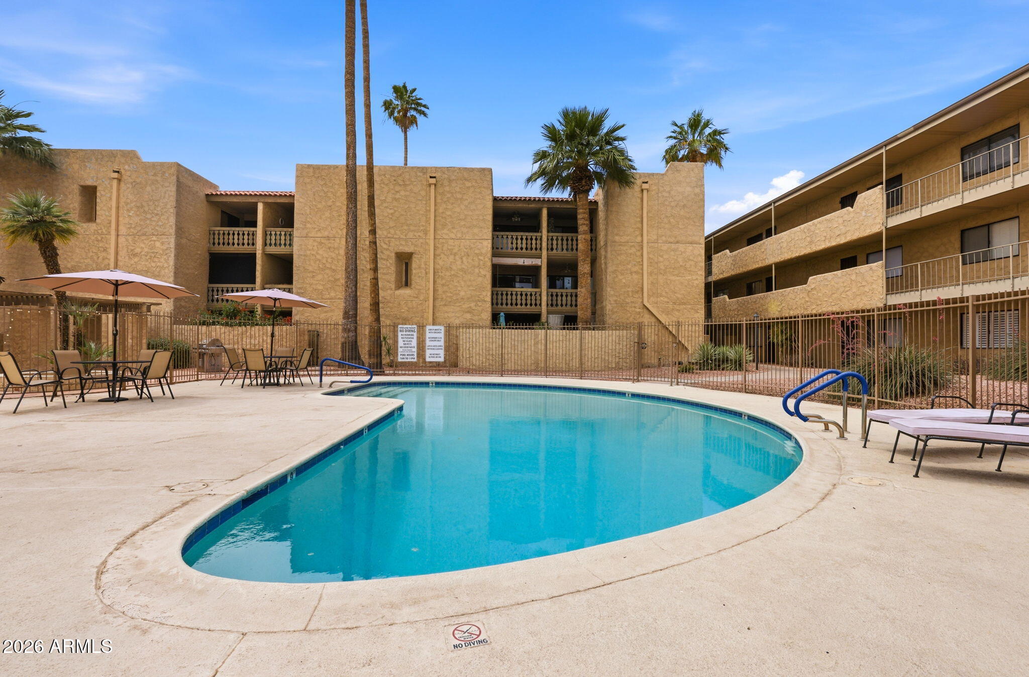 4950 North Miller Road, Unit 339 Scottsdale, AZ 85251 - Photo 4 of 28 a view of balcony with outdoor seating