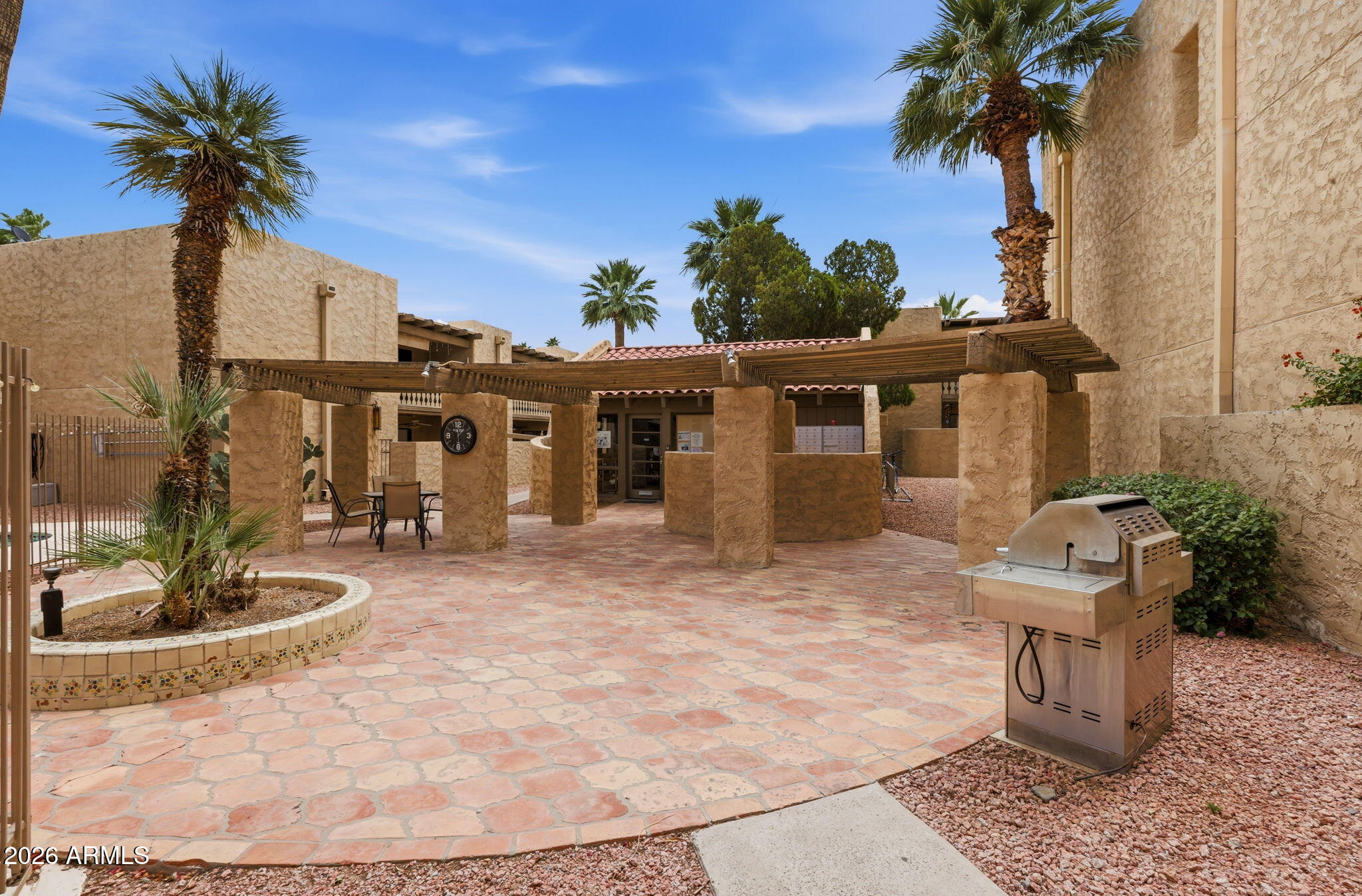 4950 North Miller Road, Unit 339 Scottsdale, AZ 85251 - Photo 6 of 28 a front view of a house with garden