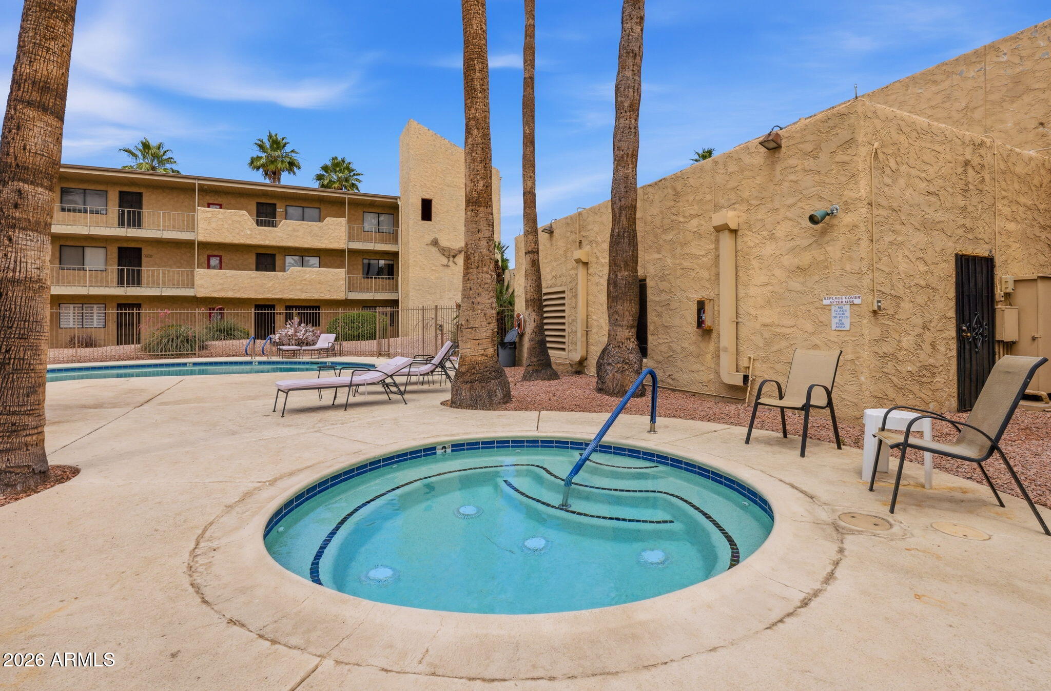 4950 North Miller Road, Unit 339 Scottsdale, AZ 85251 - Photo 7 of 28 a view of swimming pool with outdoor seating