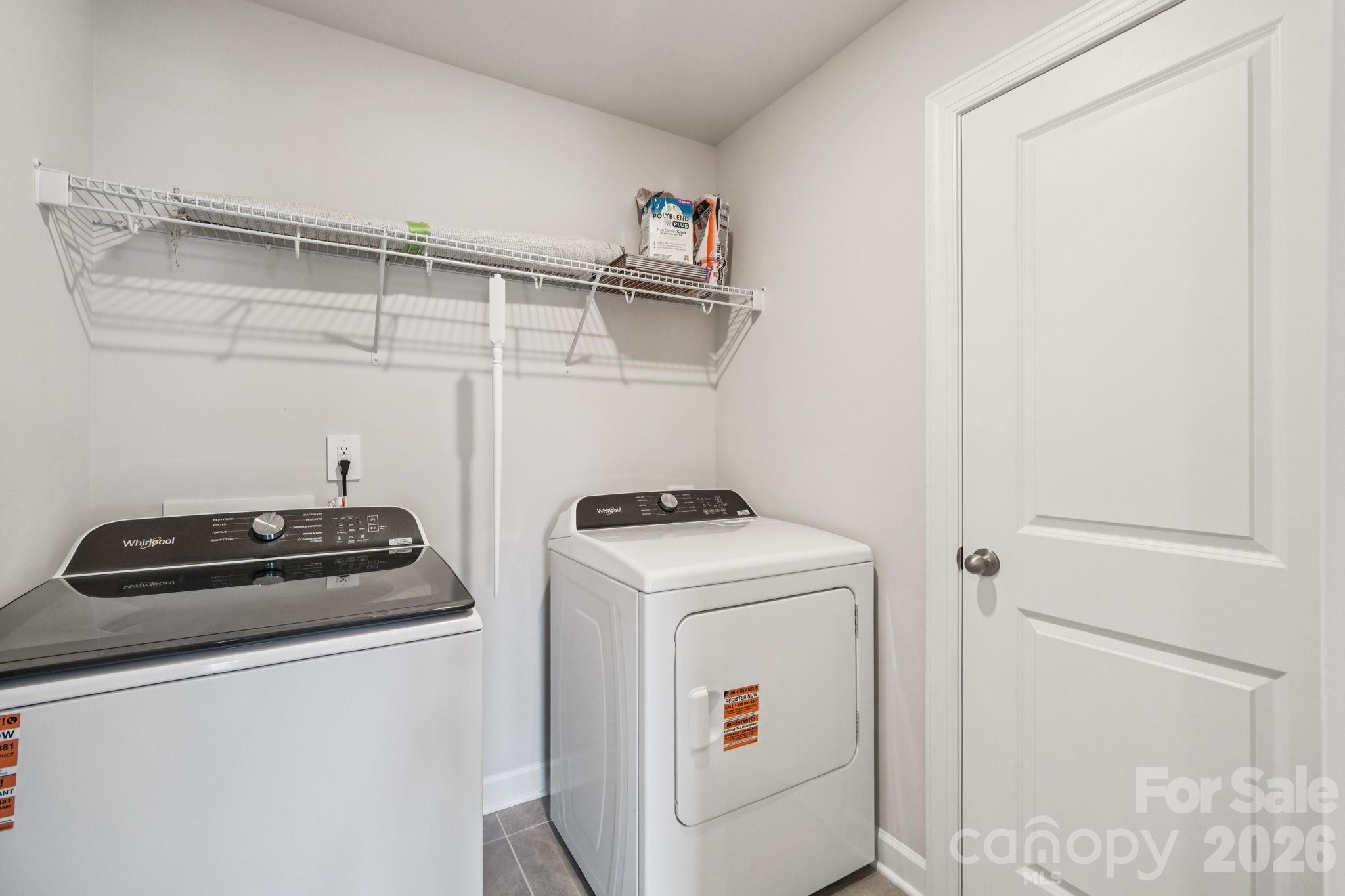 2452 Chartwell Street Stanley, NC 28164 - Photo 10 of 15 a view of storage and utility room with washer and dryer