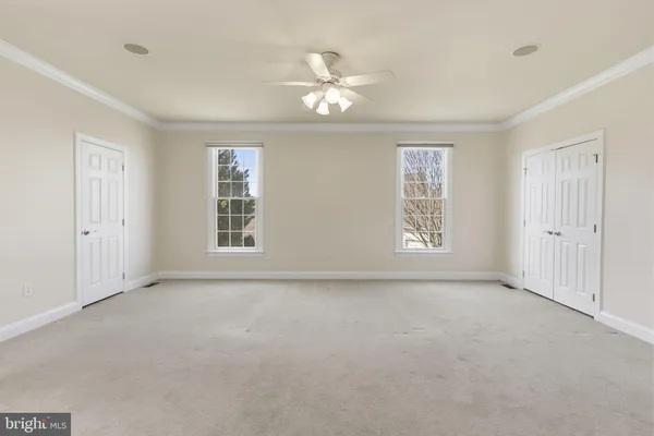 a bathroom with a tub sink shower and mirror