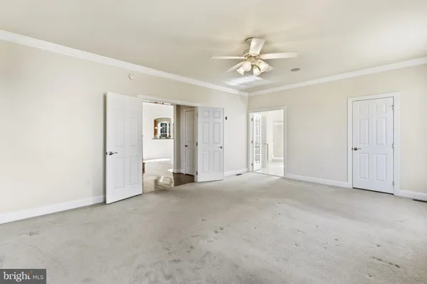 a view of a hallway with sliding door and stairs