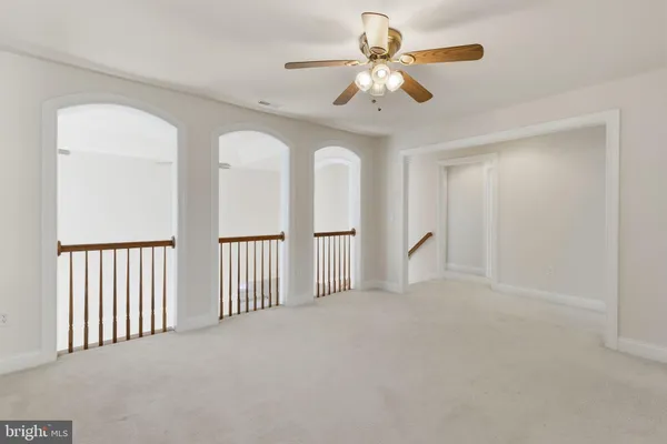 a bathroom with a sink a toilet and a large mirror