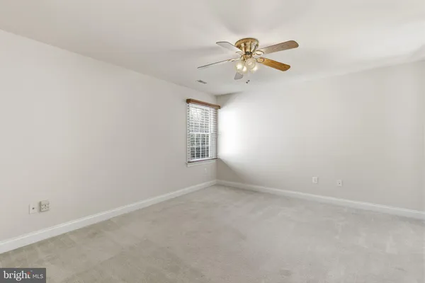 a front view of a house with a blue gate
