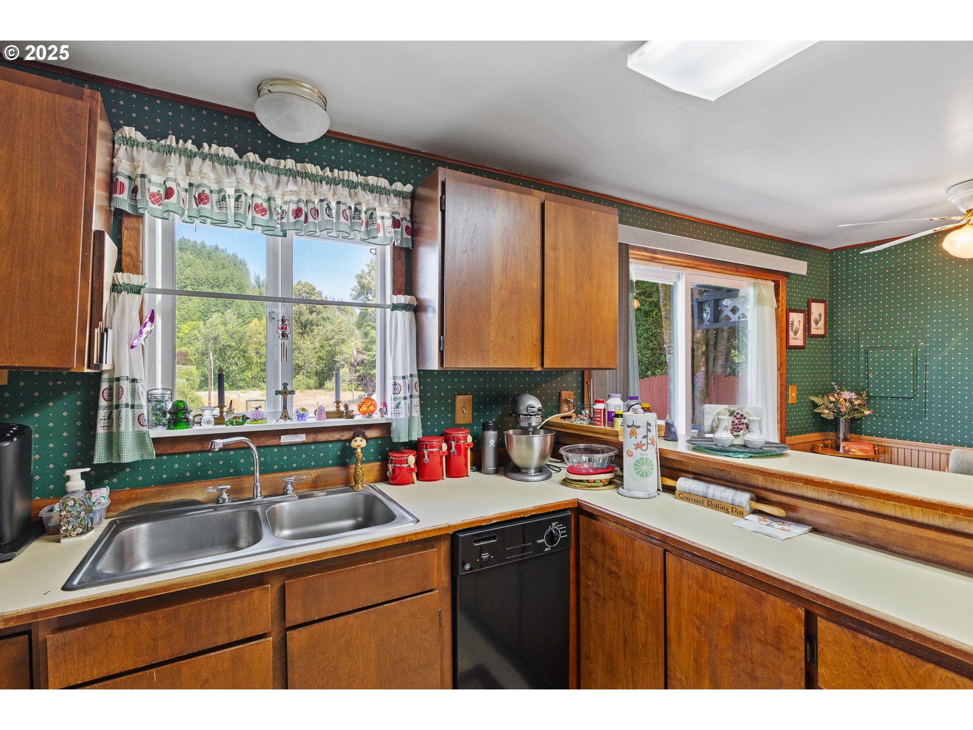 51320 Myrtle Creek Road Myrtle Point, OR 97458 - Photo 19 of 44 a kitchen with a sink stove and cabinets