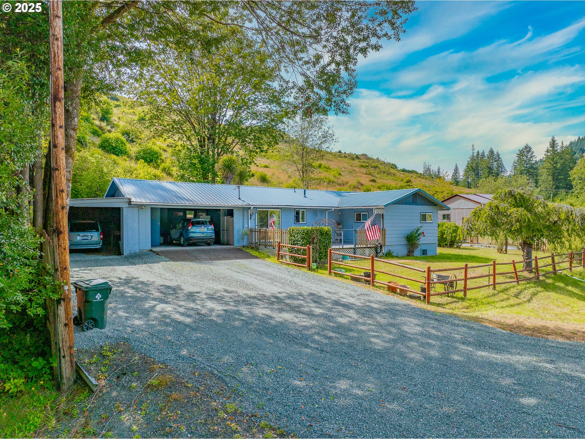 51320 Myrtle Creek Road Myrtle Point, OR 97458 - Photo 2 of 44 a view of a house with a yard and hanging chair