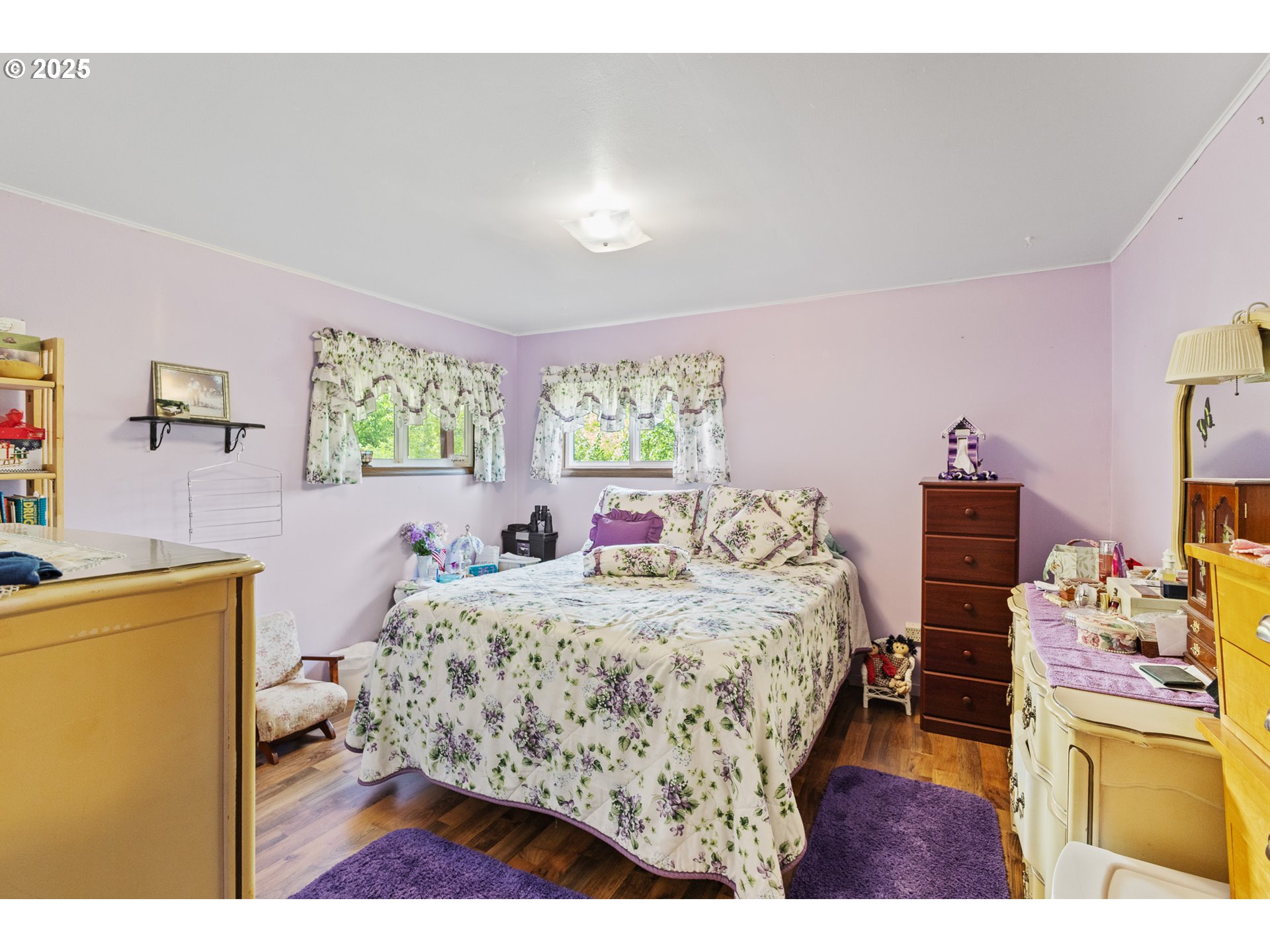 51320 Myrtle Creek Road Myrtle Point, OR 97458 - Photo 25 of 44 a bedroom with a bed and wooden floor
