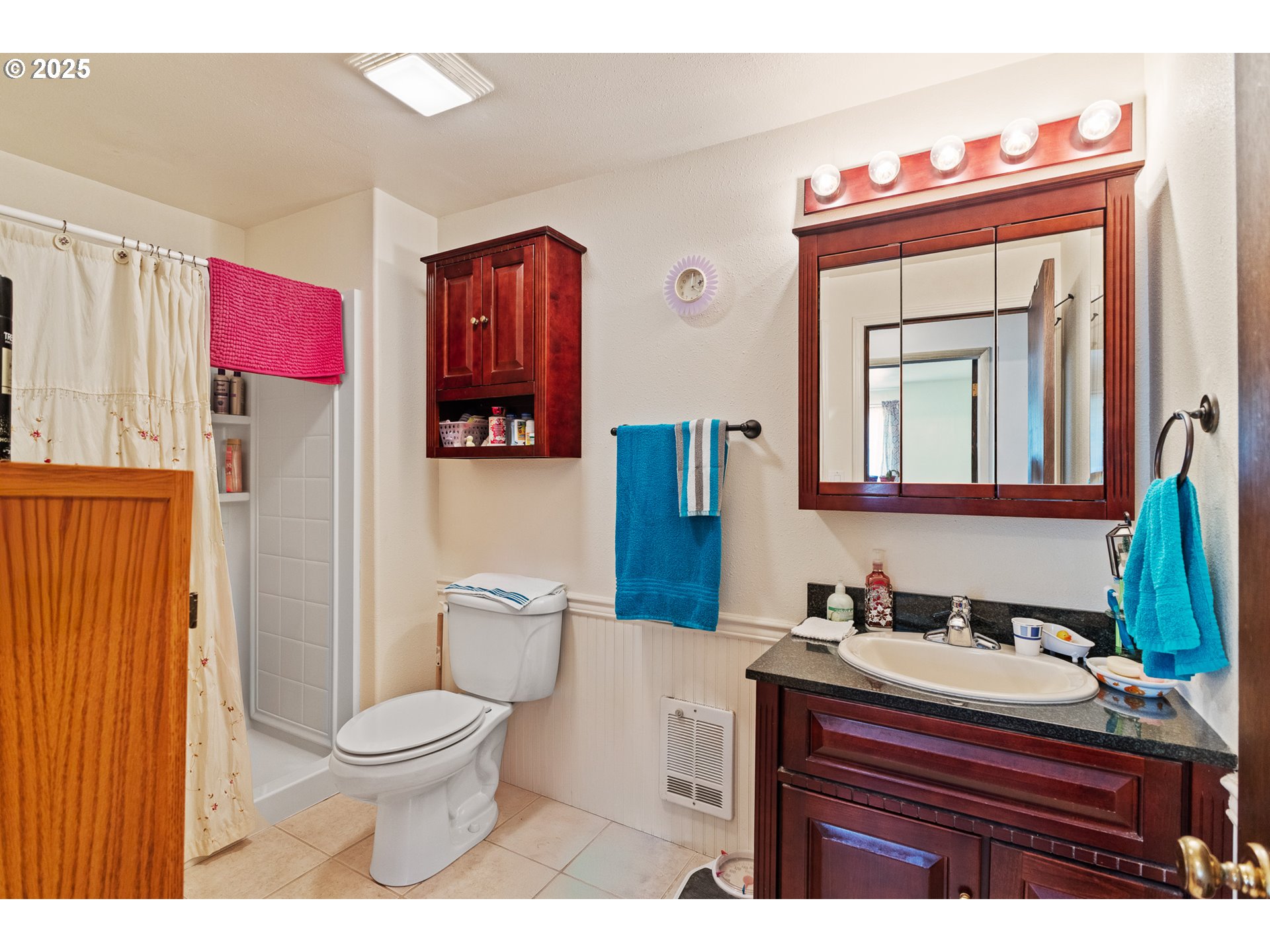 51320 Myrtle Creek Road Myrtle Point, OR 97458 - Photo 28 of 44 a bathroom with a sink vanity mirror and toilet