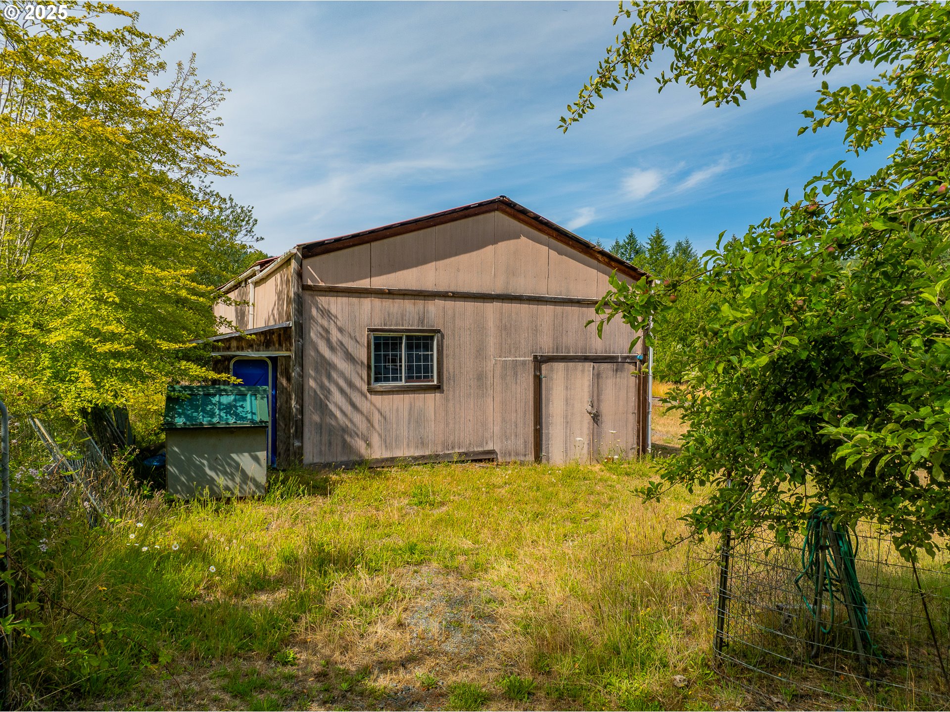 51320 Myrtle Creek Road Myrtle Point, OR 97458 - Photo 37 of 44 a view of a house with a yard