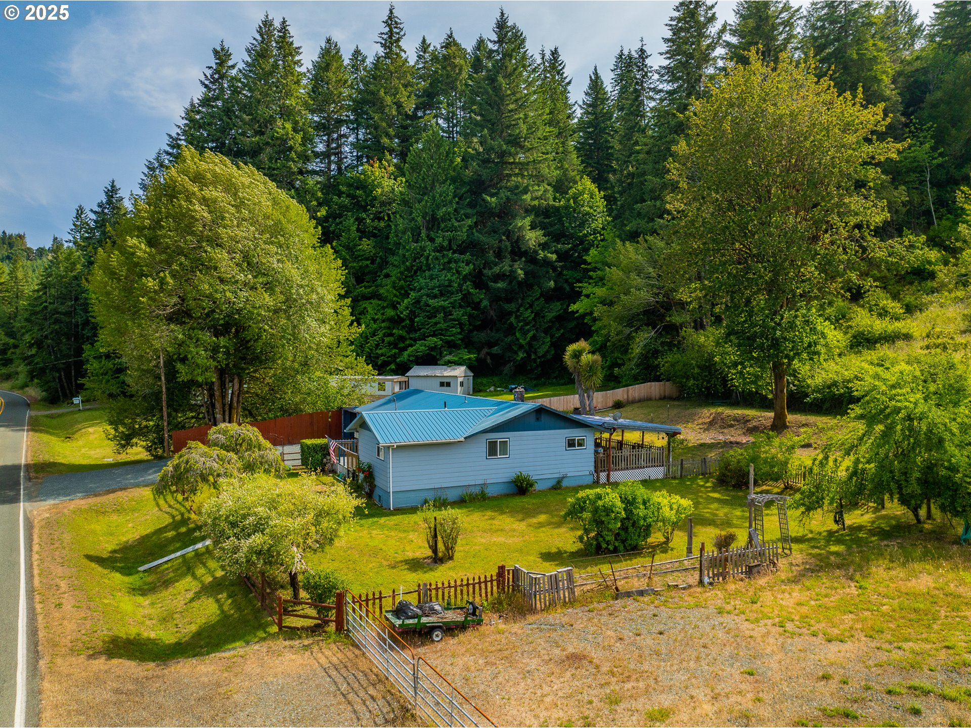51320 Myrtle Creek Road Myrtle Point, OR 97458 - Photo 39 of 44 an aerial view of a house with swimming pool and garden