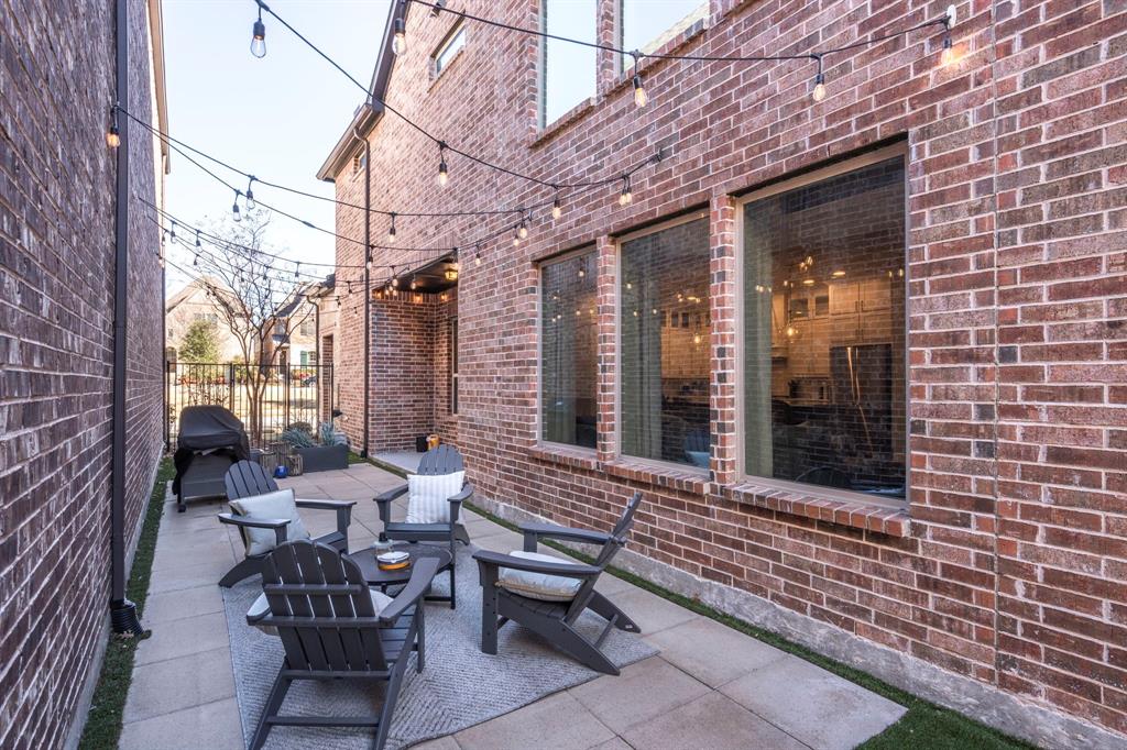 6216 Exeter Avenue McKinney, TX 75070 - Photo 34 of 40 Patio located on the North side of the house with new cafe lights.