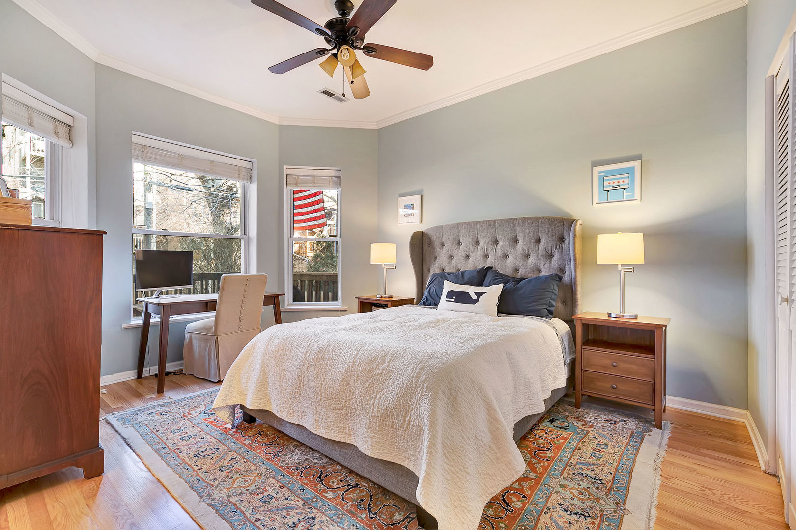 2837 North Burling Street, Unit 1S Chicago, IL 60657 - Photo 13 of 17 a bedroom with a large bed and a chandelier