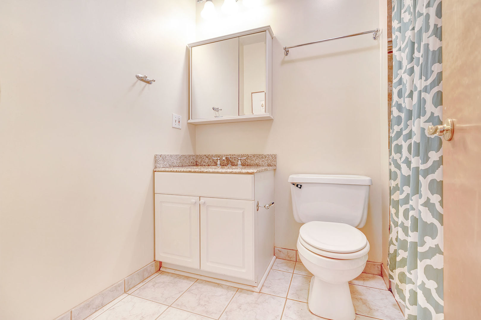 2837 North Burling Street, Unit 1S Chicago, IL 60657 - Photo 14 of 17 a white toilet sitting next to a shower curtain