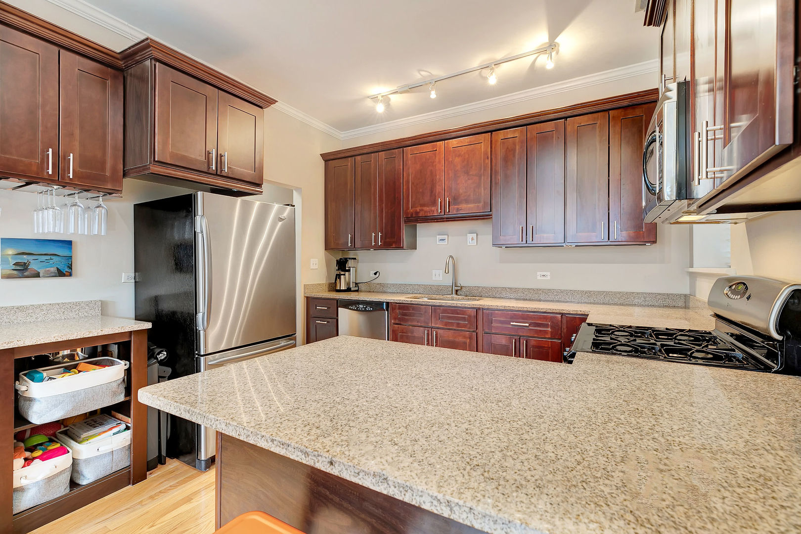 2837 North Burling Street, Unit 1S Chicago, IL 60657 - Photo 7 of 17 a kitchen with stainless steel appliances granite countertop a refrigerator and a stove top oven