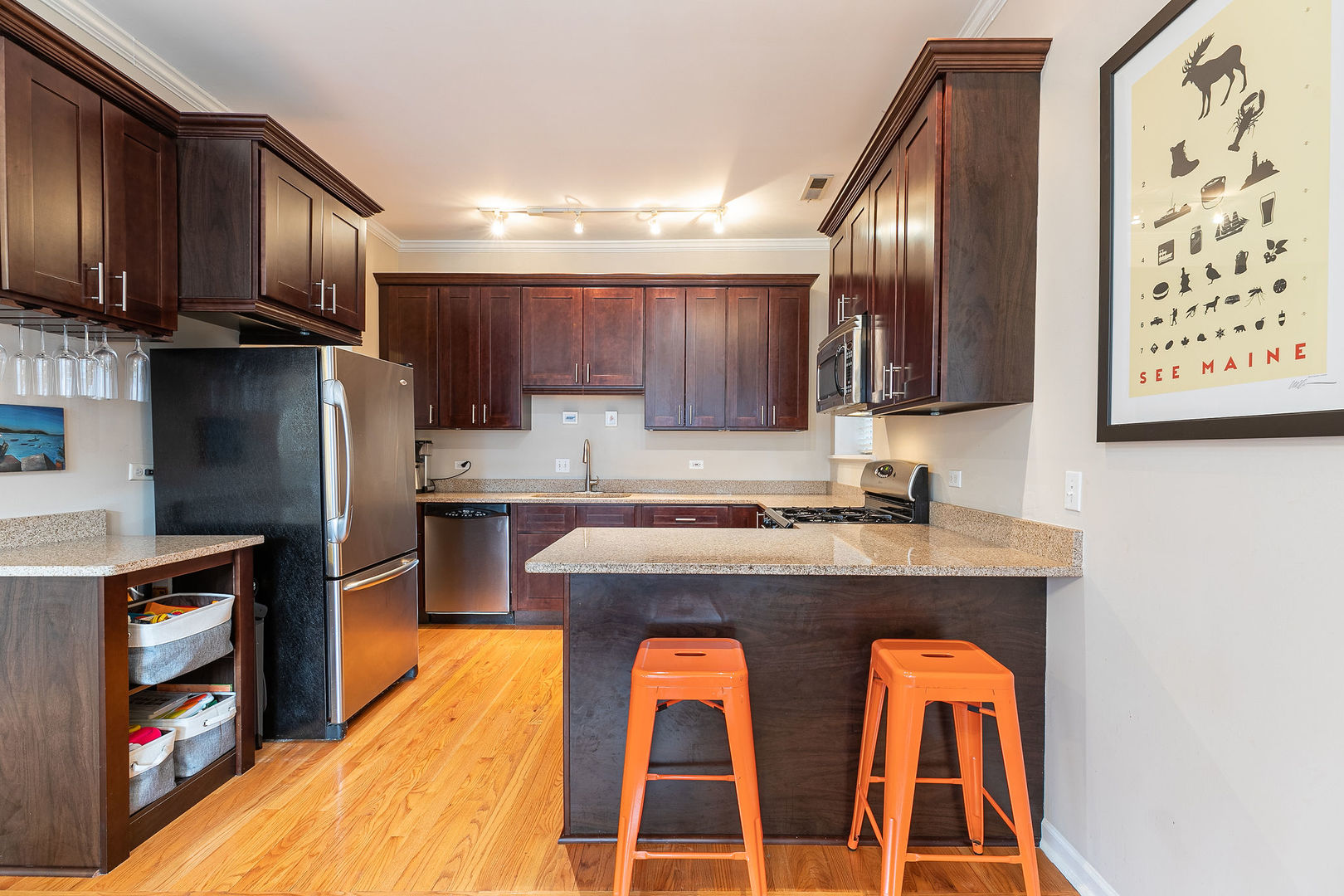 2837 North Burling Street, Unit 1S Chicago, IL 60657 - Photo 8 of 17 a kitchen with stainless steel appliances granite countertop a refrigerator and a stove top oven