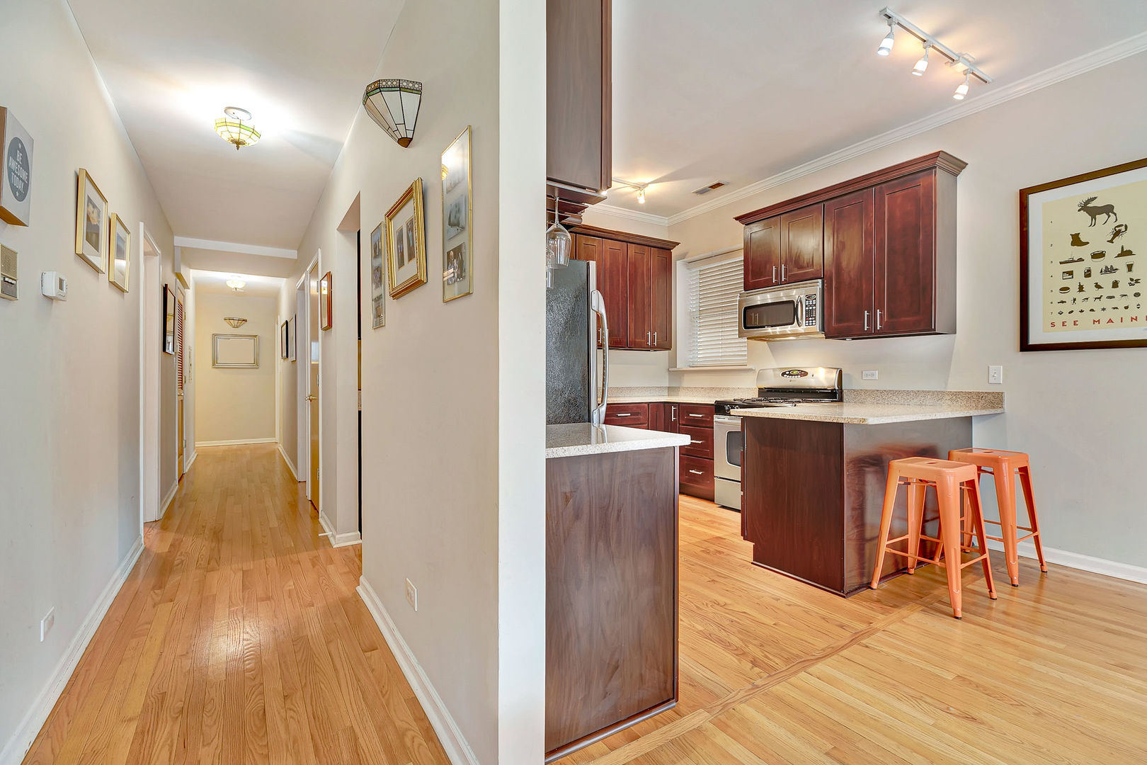 2837 North Burling Street, Unit 1S Chicago, IL 60657 - Photo 10 of 17 a view of kitchen with stainless steel appliances granite countertop a refrigerator and a stove top oven