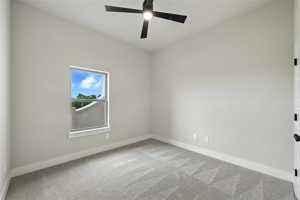 224 Kilkenny Road Poolville, TX 76487 - Photo 20 of 32 an empty room with windows and cabinet