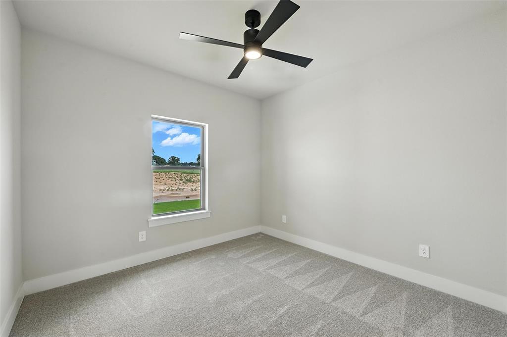 224 Kilkenny Road Poolville, TX 76487 - Photo 22 of 32 an empty room with a window and a fan