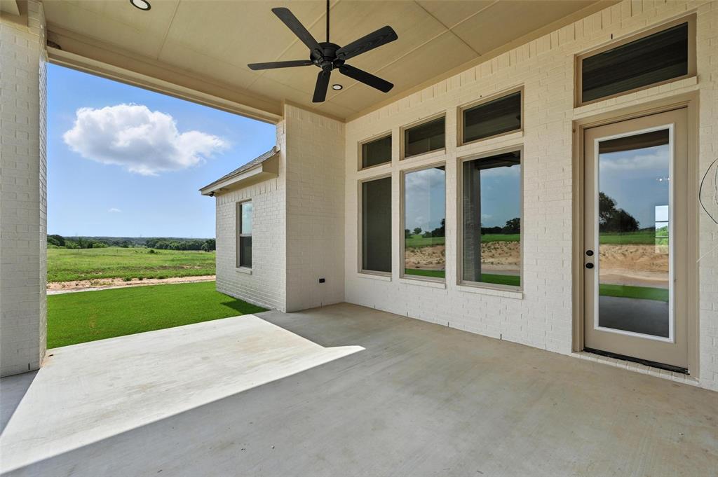 224 Kilkenny Road Poolville, TX 76487 - Photo 31 of 32 a view of a porch with a floor to ceiling windows and yard