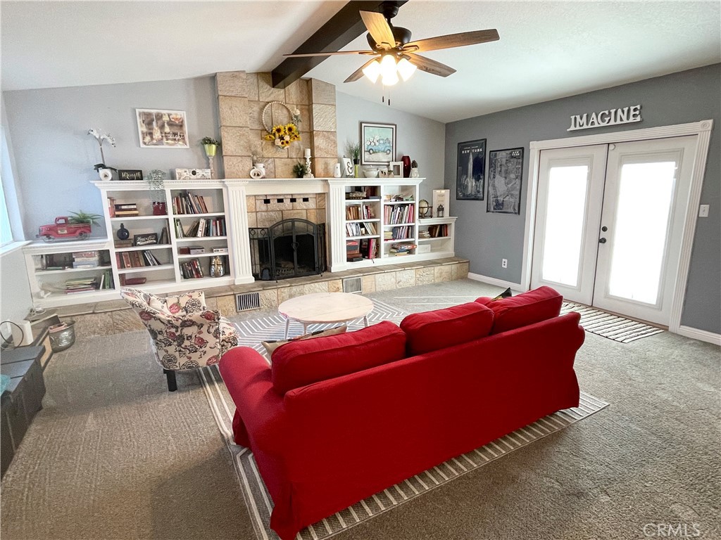 3332 Shamrock Avenue Merced, CA 95340 - Photo 14 of 35 a living room with furniture fireplace and flat screen tv