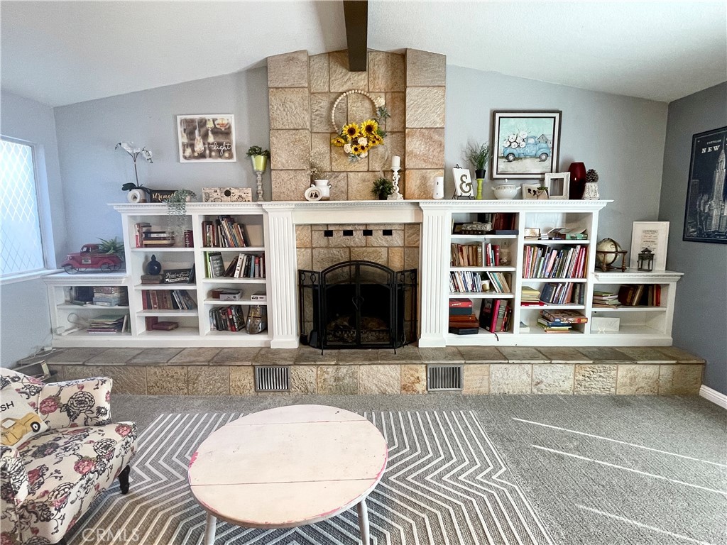 3332 Shamrock Avenue Merced, CA 95340 - Photo 16 of 35 a living room with furniture and a fireplace