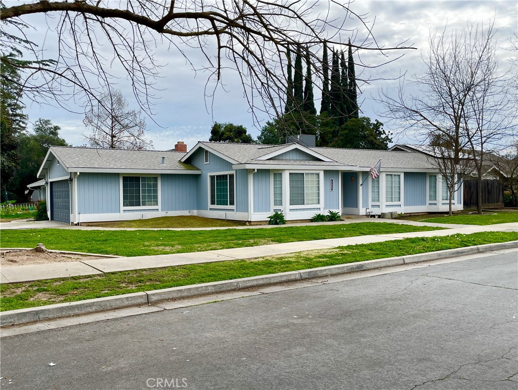 3332 Shamrock Avenue Merced, CA 95340 - Photo 2 of 35 a front view of a house with a yard
