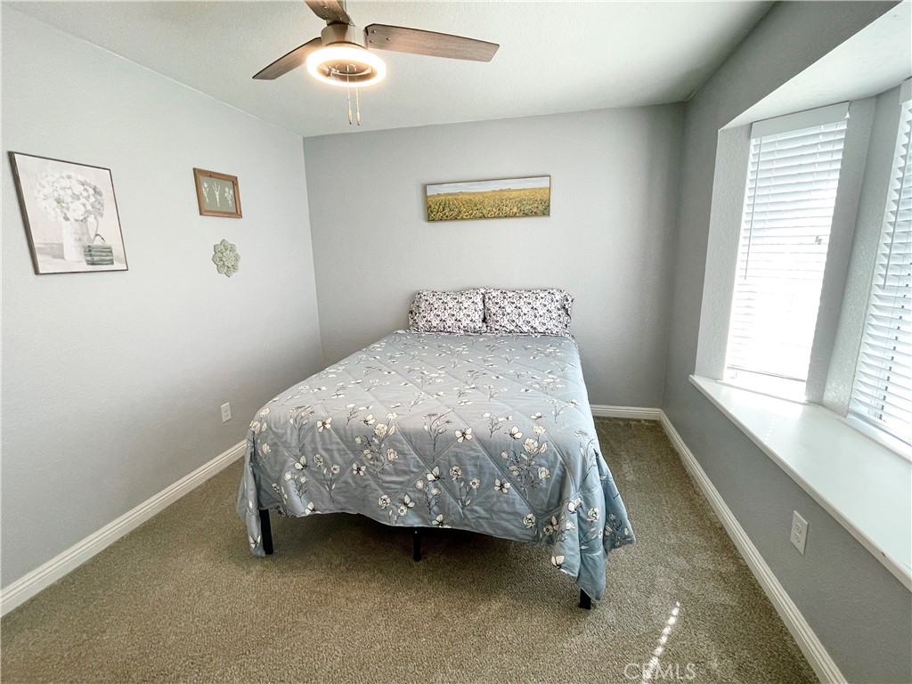 3332 Shamrock Avenue Merced, CA 95340 - Photo 23 of 35 a bedroom with a bed and a window