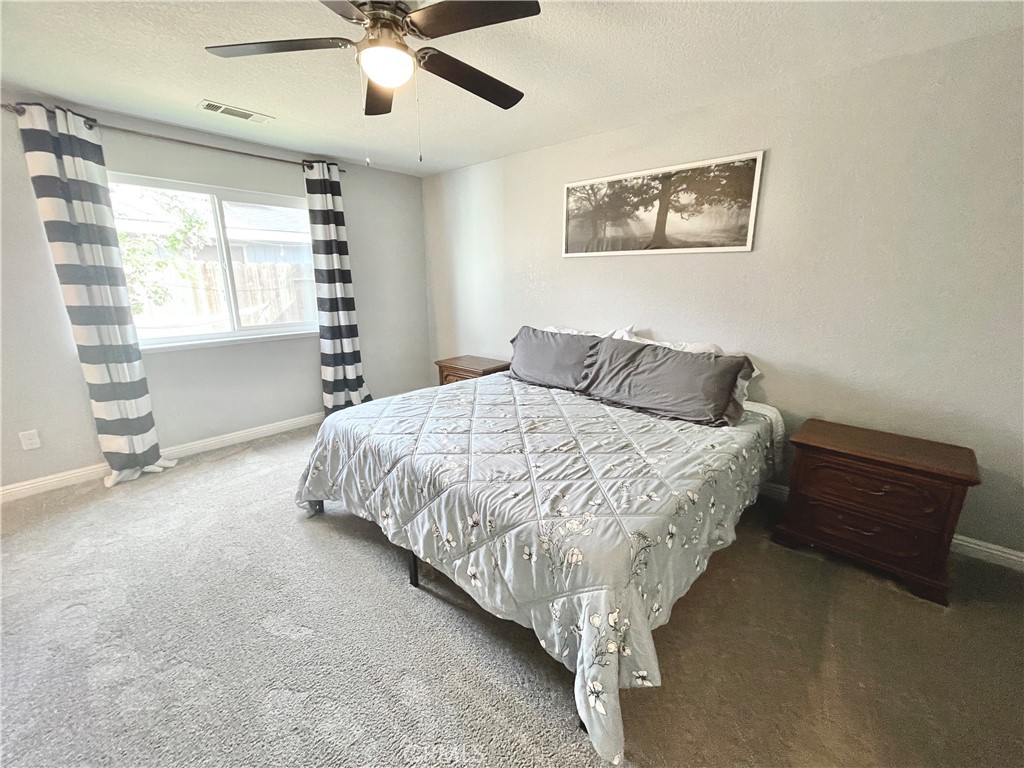 3332 Shamrock Avenue Merced, CA 95340 - Photo 24 of 35 a bedroom with a bed and a window