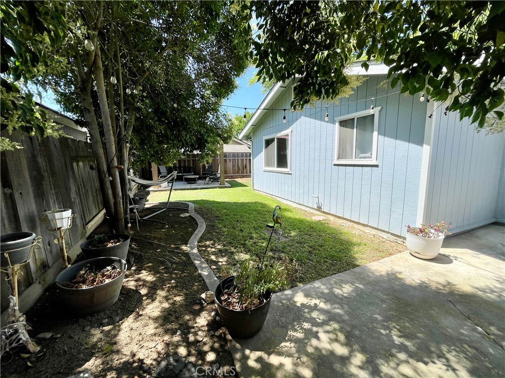 3332 Shamrock Avenue Merced, CA 95340 - Photo 30 of 35 a backyard of a house with yard and outdoor seating