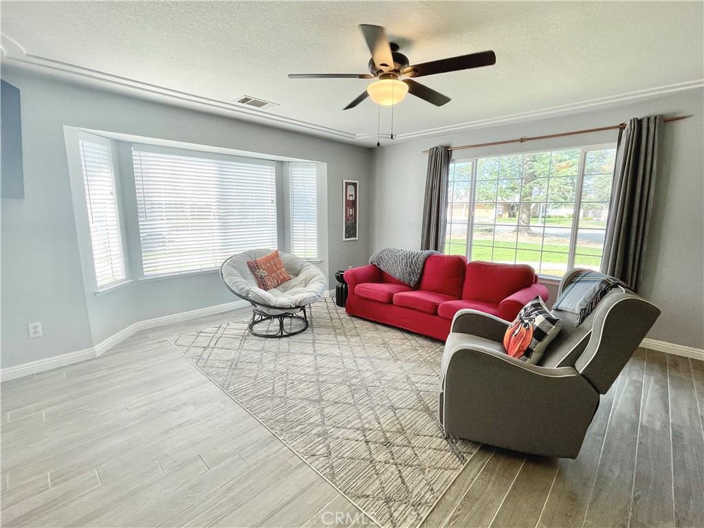 3332 Shamrock Avenue Merced, CA 95340 - Photo 4 of 35 a living room with furniture and wooden floor