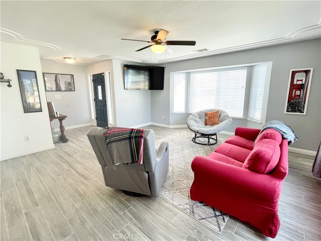 3332 Shamrock Avenue Merced, CA 95340 - Photo 6 of 35 a living room with furniture and a large window