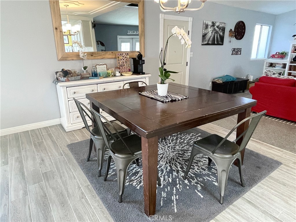 3332 Shamrock Avenue Merced, CA 95340 - Photo 7 of 35 a view of a dining room with furniture and wooden floor